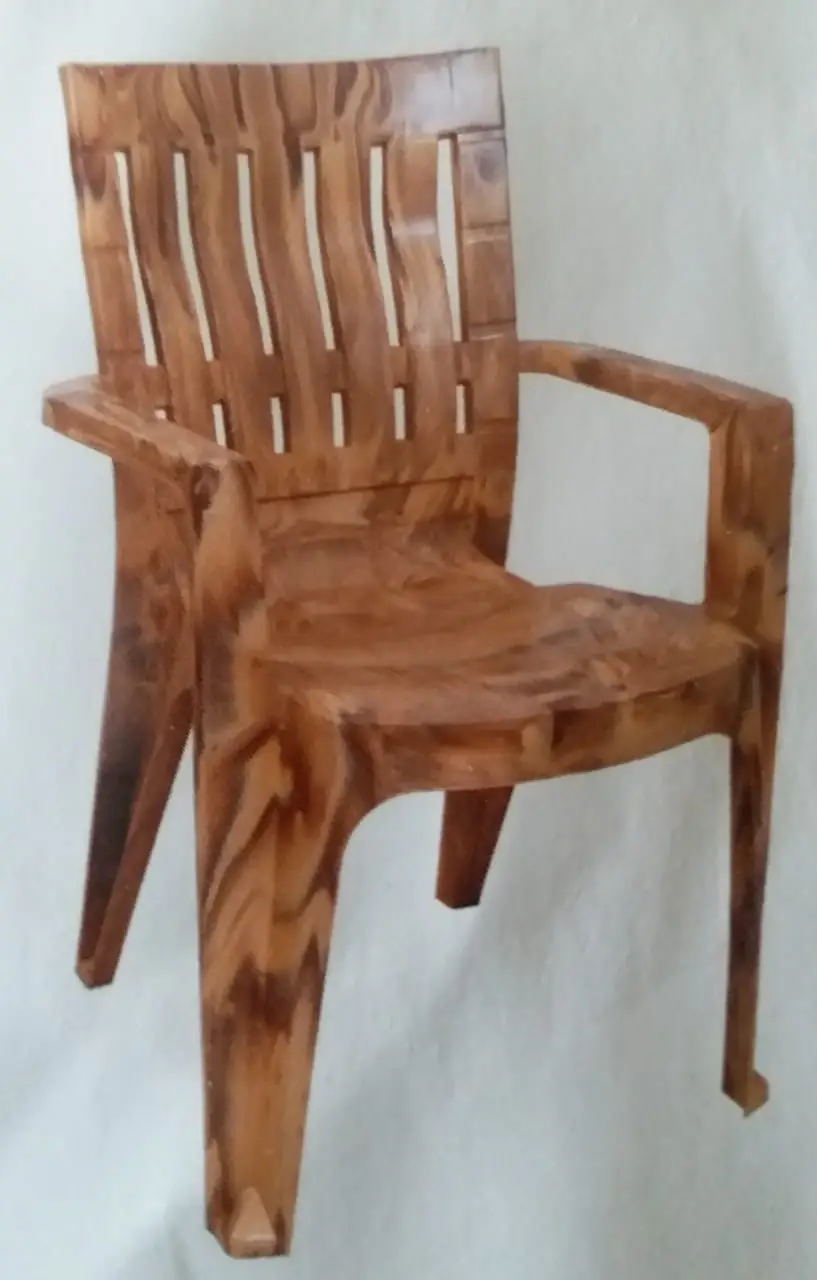Plastic chair with wooden effect finish made with a two colour attachment