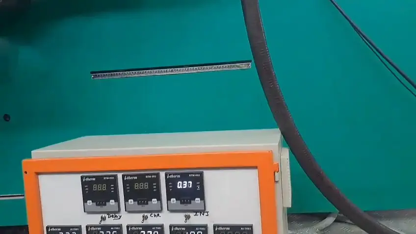 Temperature controllers on an injection moulding machine control panel